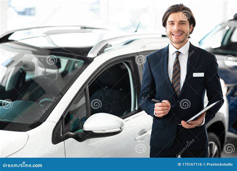 Salesman Selling Car Standing In Dealership Center Stock Photo Image