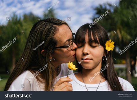 Portrait Latina Mother Daughter Kissing Each Stock Photo 1940877052