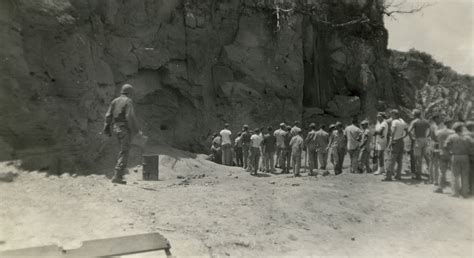Us Servicemen Lined Up To Explore Japanese Caves On Iwo Jima Following