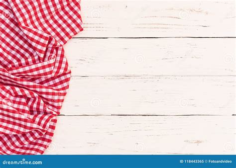 Red Checked Picnic Tablecloth On Left Side Of White Wooden Table