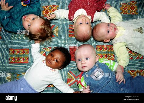 Five Babies Laying Down In Creche Southwark South London Uk Stock