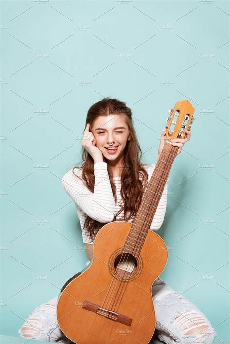 Beautiful Young Girl Posing With Guitar Featuring Guitar Music And