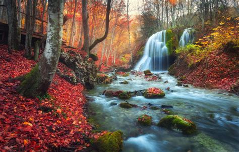 Autumn Forest With Waterfall At Mountain River At Sunset Stock Image