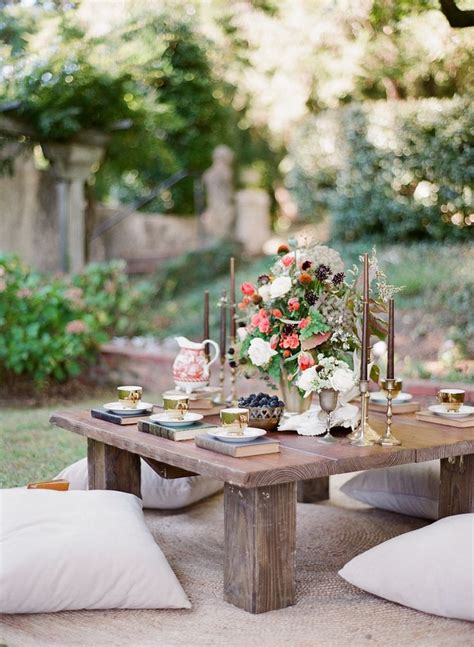 Picture Of A Low Picnic Table With Candles A Lush Floral