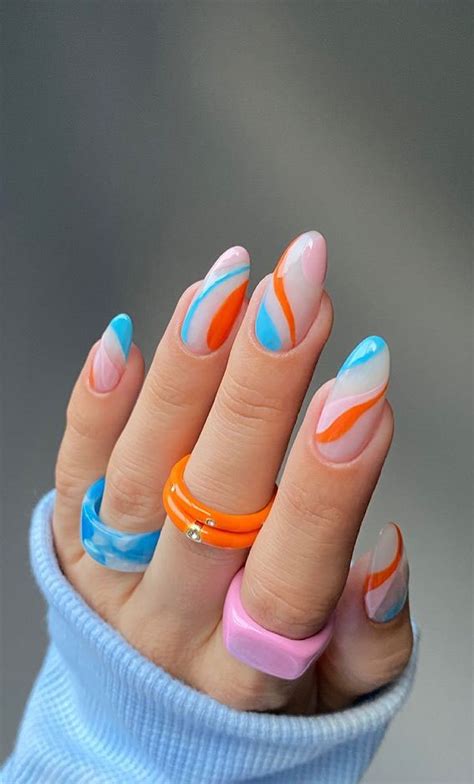 30 Coolest Summer Nails 2021 Bright Blue And Orange Fun Swirl Nails