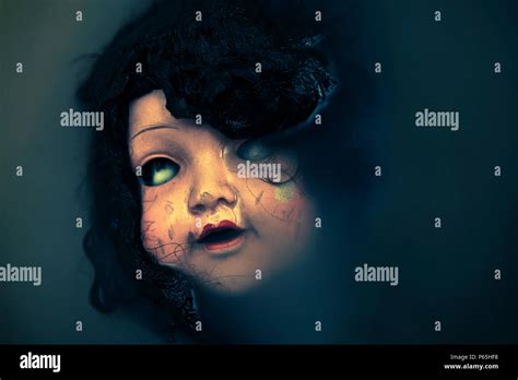 Creepy Doll Face In Dark Dirty Water Stock Photo Alamy