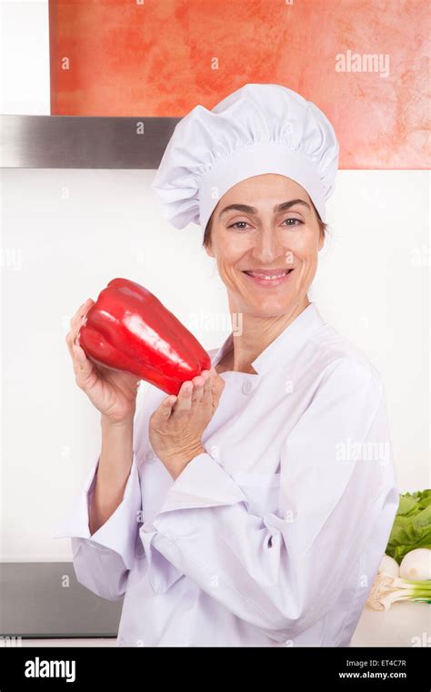Portrait Of Brunette Happy Chef Woman With Professional Jacket And Hat