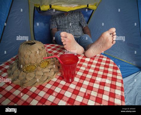 Bare Feet On Picnic Table In Tent Stock Photo Alamy