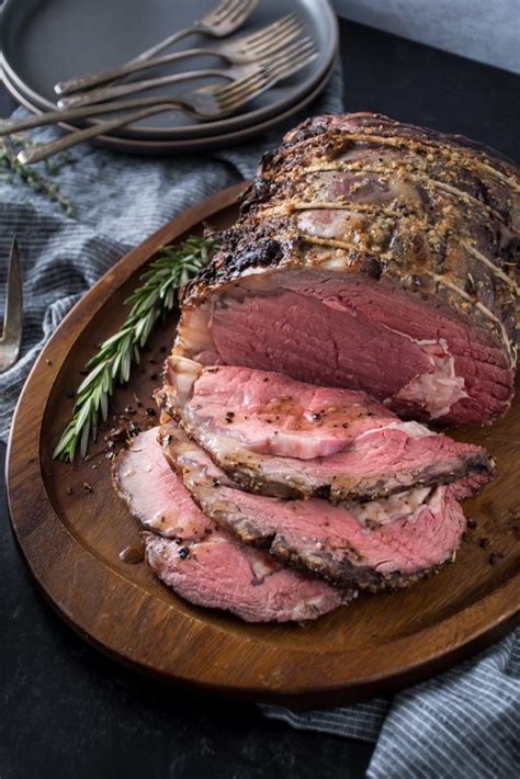 After the meat is browned, transfer it to a roasting pan. Garlic-Crusted Prime Rib - Kitchen Joy