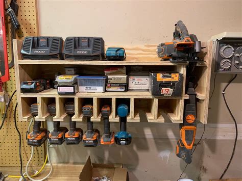 A Workbench With Many Tools On It Including Drillers And Screwdrivers