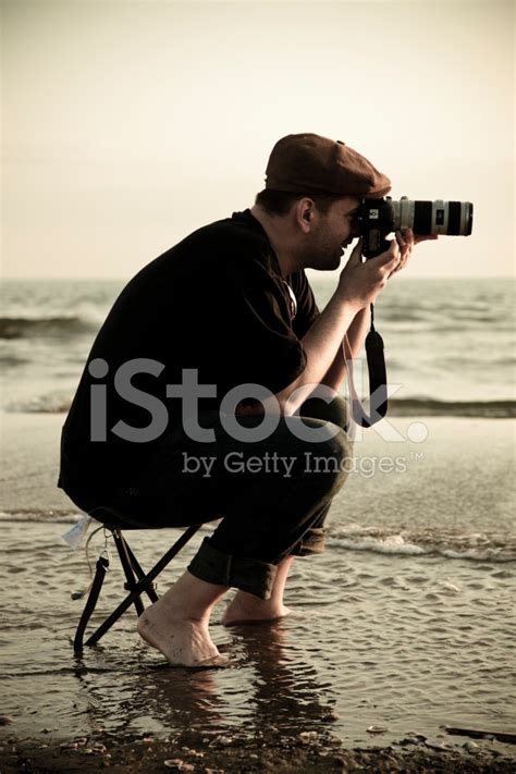 Photographer In Action Stock Photo Royalty Free Freeimages