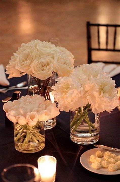 Glass Cylinders Wedding Centerpieces With Monochromatic White Floral