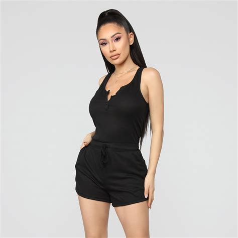 Black Sleeveless Romper With Strap And Fitted Design