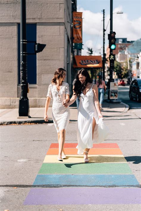 allie and sam on a rainbow cross walk lesbian couple brunch wedding our wedding