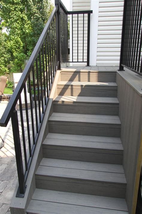 Before building deck stair railings, you have to learn how to attach deck posts, otherwise you won't drilling hole in deck post to fasten handrail. decks - composite deck stairs with black aluminum railings ...