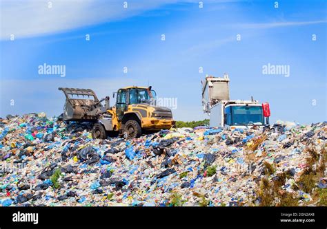 garbage truck unloading at a landfill Stock Photo - Alamy