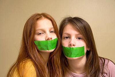 Preteen Girls With Green Tape On Their Mouths Stock Photo Picture And