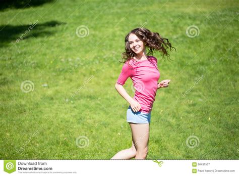 Beautiful Girl Pink T Shirt Fun On The Grass Stock Image Image Of Person Blue 60431557