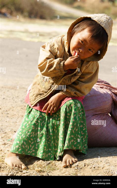 Asian Children Hungry And Eating Dirty Clothing Barefoot Poverty