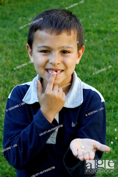 7 Year Old Boy Showing A Missing Tooth Stock Photo Picture And Rights