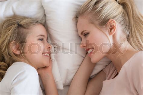 top view of smiling daughter and mother stock image colourbox