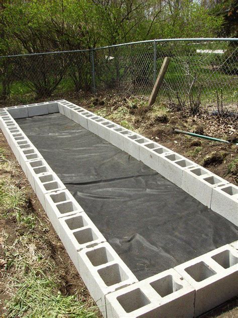 He grows enough food to donate a huge amount to his local food bank. DIY Cinder Block Raised Garden Bed | The Owner-Builder ...