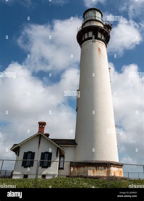 Lighthouse With Cloudy Skies Stock Photo Alamy