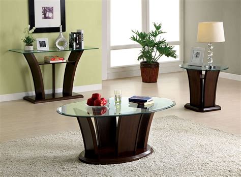 The solid wood frame displays a warm pecan finish and supports a tempered glass table top, creating a clean and open look. Keystone Dark Cherry Unique Wood Base Glass Top Coffee Table