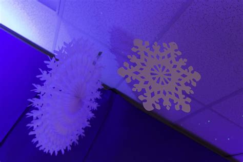 Paper snowflakes can look beautiful in your windows as holiday curtains. Hang snowflakes from the ceiling to create a winter ...