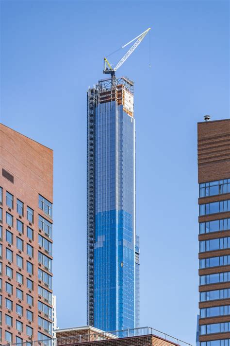 Central definition, of or forming the center: Central Park Tower's Glass Curtain Wall Approaches its ...