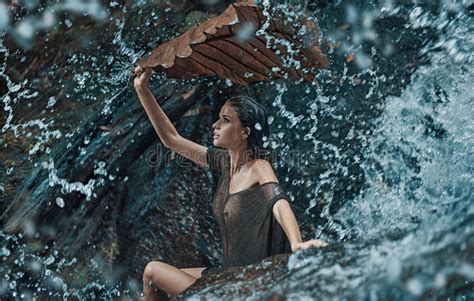 Beautiful Brunette Woman Enjoying The Tropical Waterfall Stock Image