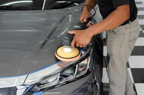 Car Detailing Male Mechanic Holding Car Polishing Machine Auto