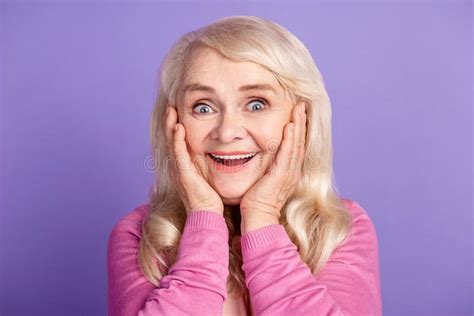 Photo Of Aged Excited Cheerful Woman Hands Touch Cheeks Reaction