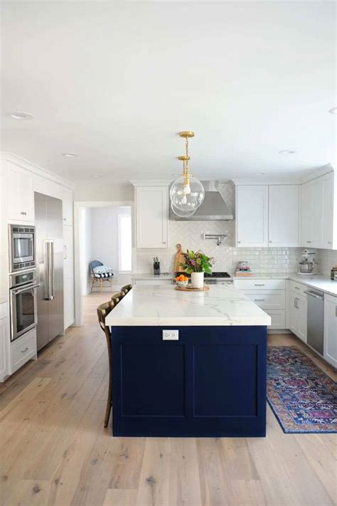 White Kitchen With Marble Look Countertops Gray Island White Oak