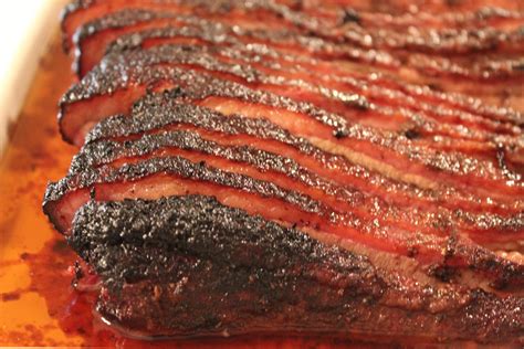 Dry Rubbed Smoked Brisket Is Slow Cooked On A Smoker Then Wet Mopped Throughout The Process To