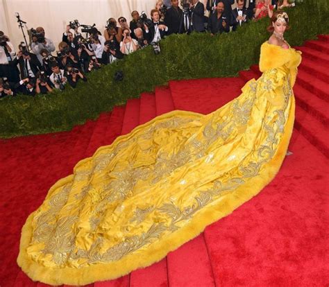 Rihanna Wearing A Golden Yellow Embroidered Gown At Met Gala 2015 Designed By Guo Pei Met Gala