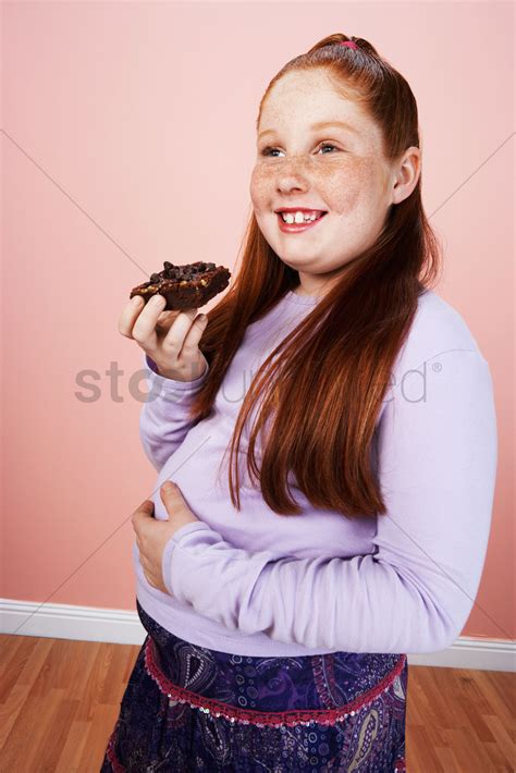 Overweight Girl 13 15 Smiling Holding Brownie Hand On