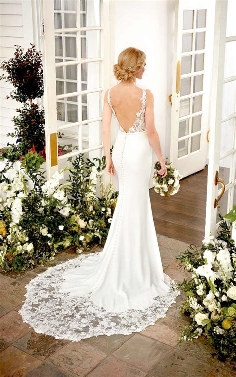 A modern lace pattern mixed with a sleek and chic crepe skirt creates one of the hottest dresses in this collection. Simple Wedding Dress with Sheer Lace Sides - Martina Liana