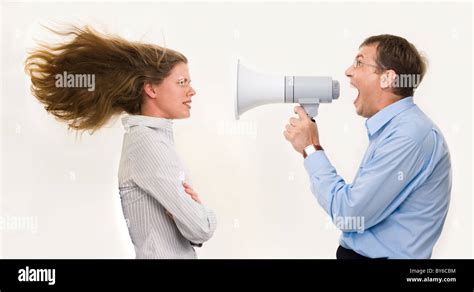 Image Of Strict Boss Shouting At Businesswoman Through Loudspeaker So