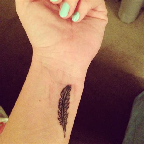 Feather Tattoo On Wrist Feather Tattoo Feather Tattoos Tattoos