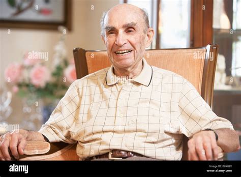 Senior Man Resting In Armchair Stock Photo Alamy