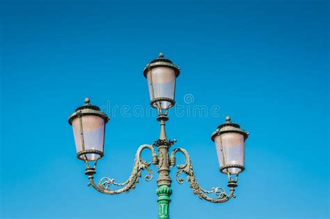 Streetlight Vintage Style Retro Lamppost On Blue Sky Background Stock