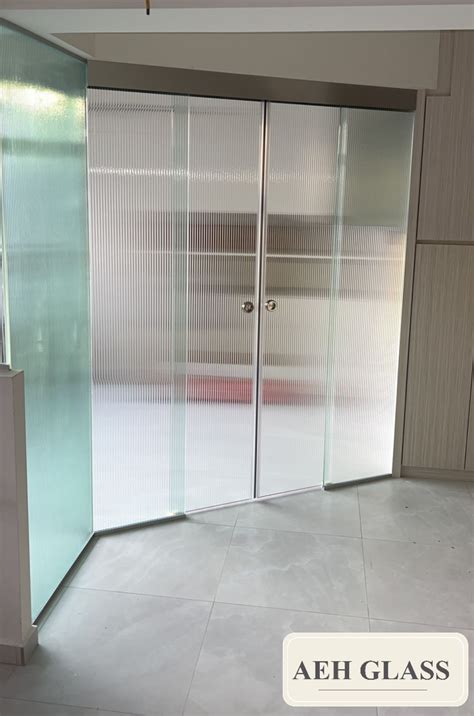 fluted reeded glass partition and sliding door aeh glass construction