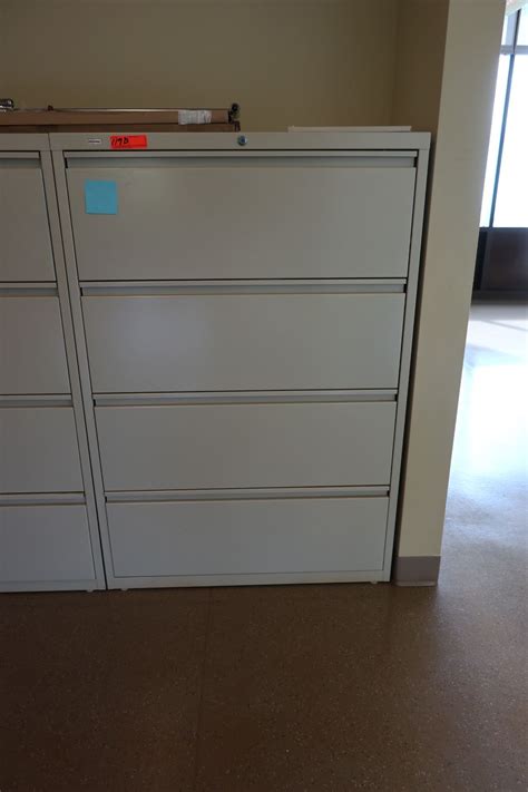 This lateral file cabinet is a great option to organize important documents in your home office. 4-Drawer Lateral File Cabinet - Oahu Auctions