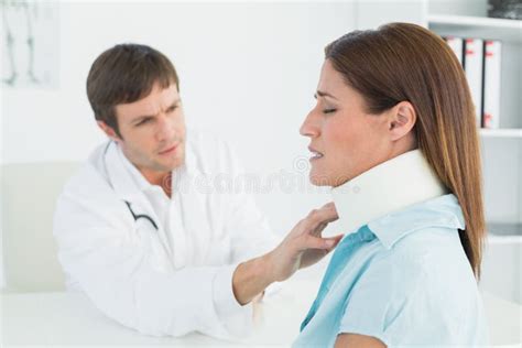 Doctor Examining A Patients Sprained Neck At Office Stock Image Image
