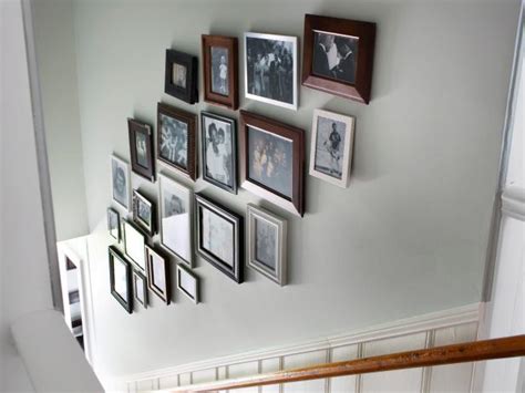 If your picture has white borders and you don't want them to show, be sure to trim them off before you take your measurements to ensure the final measurement. Create a Gallery Wall in a Stairwell | HGTV