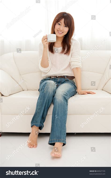 Beautiful Asian Woman Relaxing On The Couch Stock Photo Shutterstock