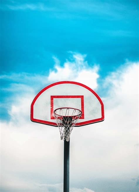 Basketball Red And Black Basketball Hoop Under Cloudy Sky Hoop Image