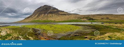 Famous Kirkjufell Mountain In Iceland With Dark Cloud Cover Stock Photo