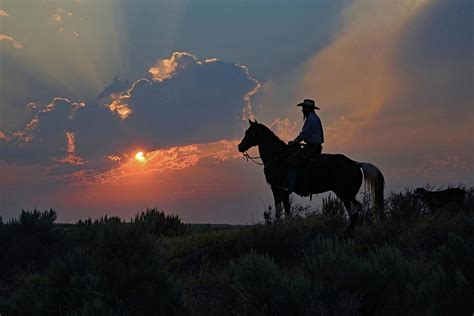 Cowboy Sunset Photograph By Brian Wartchow Pixels